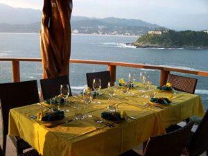 Outdoor dining with view of Santiago Bay - Villa Dos Palapas, La Punta; Manzanillo