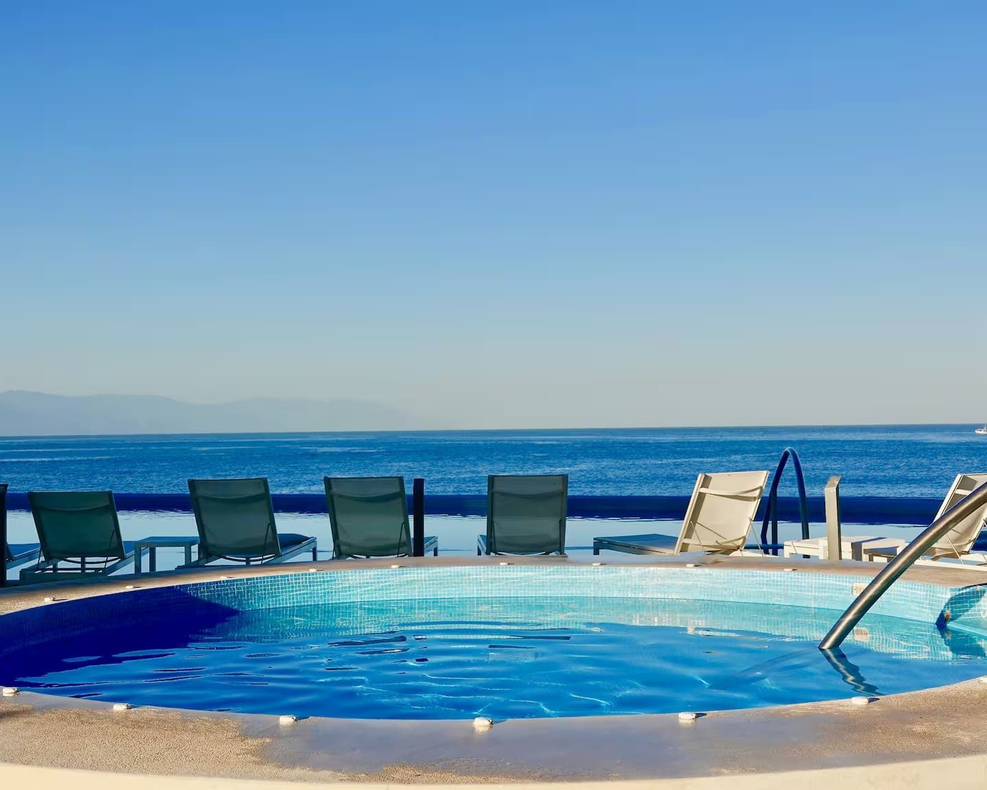 Lounge chairs for guest use at the pools