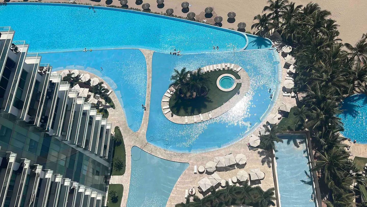 The view from our balcony looking down at the huge pool of the Península! Kids love it!